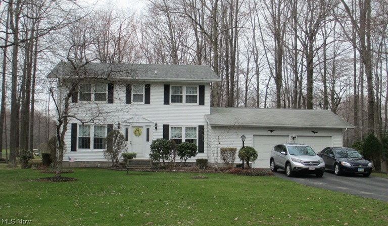 Wake up to coffee on the deck overlooking Village Green Golf Course. So many features to this 2,400 sq. ft colonial: Living Rm, Family Rm, Dining Rm, eat-in kitchen, office area with wood burning fireplace. New laminate flooring in kitchen and foyer - 4/2014. Updated carpeting in all bedrooms, master bath remodeled. 2nd full bath new flooring 2013. Partially finished basement with open rec room and bar, workshop, and storage room. Most windows replaced w/in last 3-4 years, Roof shingle-2008 garage, 2010 house. Furnace approx. 2006, Electric breakers w/ generator that stays with the property, attic had 6'' of blown insulation in 2008. City Water, 2-car attached garage and paved drive. Located on a dead end street in Buckeye Schools. Heating oil use is approx. 600-800 gallons per season depending on weather. Avg Electric as of 2/2013 $120 month. 1-yr HMS warranty. Washer/Dryer new 5/2013.