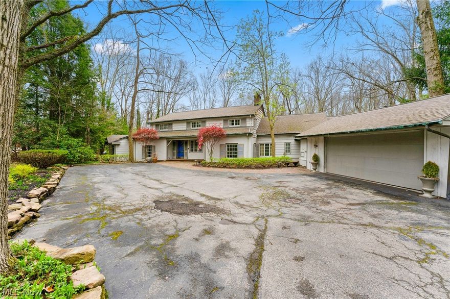 Welcome to one of most exquisite houses in Youngstown, 61 Norwick Dr. This house is a Copper Wade design with plenty of square footage nested on 2.5 acres. You will be amazed by the size of the house and the entry way into this beautiful home. The grand two story foyer welcomes you. You will walk down into an amazing formal living room with herring and bone wood flooring, amazing natural light, crown molding and charming a fireplace that flows into the formal dining room. This space has modern wallpaper that pops and can host a large gathering with built ins with  access to the Florida room. Kitchen has tons of cabinets throughout with lots of space that opens to an eat in area with wood flooring continue to a vaulted ceiling family room. This FR has a stone fireplace with access to the outside with double doors and perfect area to spend time with the family. Office of the side with built ins and storage. Large first floor laundry with tons of storage space. Mud room with access to a s