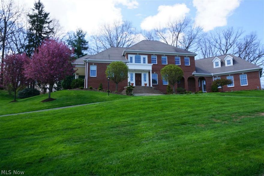 Timeless elegance is found in this exceptionally well built brick Colonial.  Situated on a gorgeous 3.32 acre home site in Jackson Township, with 4,600+ total sqft, 4 bedrooms, 4.2 baths, and walkout lower level. A stunning two-story foyer leads to large formal dining room. Spacious two-story living room features a dramatic fireplace and floor-to-ceiling windows to enjoy the wooded view. Warm hearth room with fireplace opens to dinette surrounded in windows. The kitchen is an architectural delight with Mullett mixed-finish wood cabinetry designed to resemble fine furniture pieces. Stainless and granite countertops, upscale stainless appliances, walk-in pantry, and wetbar complete the area. First floor master bedroom has two walk-in closets, beautiful bath, and private patio. Upstairs features include a Jr. suite with private bath, two BRs with Jack and Jill bath, loft/sitting area, and large bonus room. Walkout lower level has family/media room, full bath, and partially finished rec ro