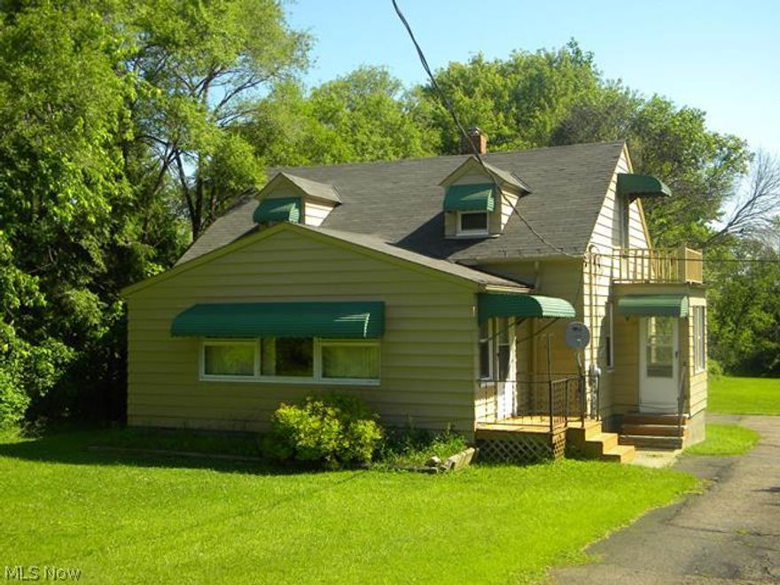 WOW!  Talk about a rare opportunity~  Almost 3 acres of land, 3 to 4 bedrooms, 1 1/2 baths, a full walk out basement, large detached garage and plenty of additional parking for your guests.  The First floor has plenty of space with a large parlor/living room as you enter the home and leads to a pretty dining room...off the dining room is another room that could have many uses... could be a bedroom, a den, office, or craft room.  This floor also has another Bedroom, Full Bath and the Kitchen.  The second floor has a huge landing area that could also serve many purposes, two additional bedrooms and a half bath round off the second floor.  There is so much character and beautiful features in this lovely home, from all the hardwood floors to all the unique spaces that are throughout.  The owner also has done a lot of upgrades since they bought it, from the new garage doors, updated windows, electrical, plumbing. A/C, Hot Water Tank.... and more! This house is priced to sell and is waiting