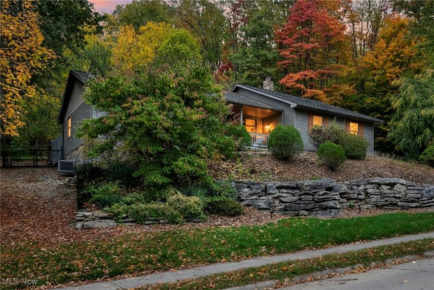 Tucked beneath a quiet canopy of mature trees, this charming ranch-style home offers the peace of a secluded cabin in the woods, all nestled on 2 spacious parcels totaling .670 acres. The smaller parcel could be sold separately, and buildable. Check to clarify with zoning. With 3 comfortable bedrooms and open floor plan the interior is both airy and warm-anchored by vaulted ceilings that lift the space and a central kitchen island perfect for gatherings.
Newer farmhouse style lighting adds a touch of rustic elegance, from your living room step out your French doors to the perfect private deck. Enjoying your morning coffee or just relaxing, you can watch the season change. A covered front porch welcomes you with timeless charm.
Downstairs a walk out unfinished basement expands the living space and leads to a tree lined yard. The attached 2 car garage provides convenience, making this home feel like your own private retreat.                                                                                           
Sellers relocating and will look at offers.