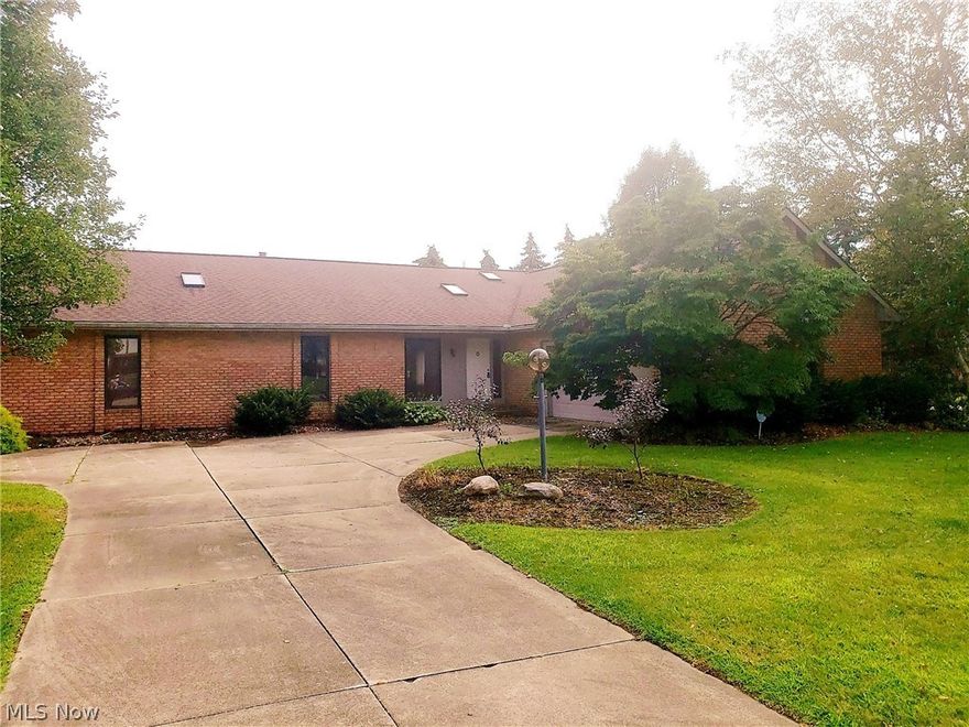 This "rare find" BRICK RANCH in BOB O LINK ESTATES has over 2876 SQFT of living space. The large FOYER leads into a stunning GREAT ROOM with a BRICK WALL FIREPLACE facing the step up DINING RM. Spacious, EAT IN KITCHEN has lots of cabinets, a center island, appliances and access to a 1ST FLR LAUNDRY & 15X14 4-SEASON ROOM! Take advantage of a BEAUTIFUL PARK LIKE setting whether you're in the backyard or on the front porch. The  MASTER BEDROOM features an "en suite," 2nd fireplace, & custom built WIC w/shelving and organizers and sliding glass door. 4th Bdr/Office/Den is ideal for anyone working from home. LOWER LEVEL has 3 large add'l rooms, extra STORAGE plus a HALF BATH! House sits on nearly a 1/2 ACRE CUL-DE-SAC LOT with 3 HUGE DECKS!