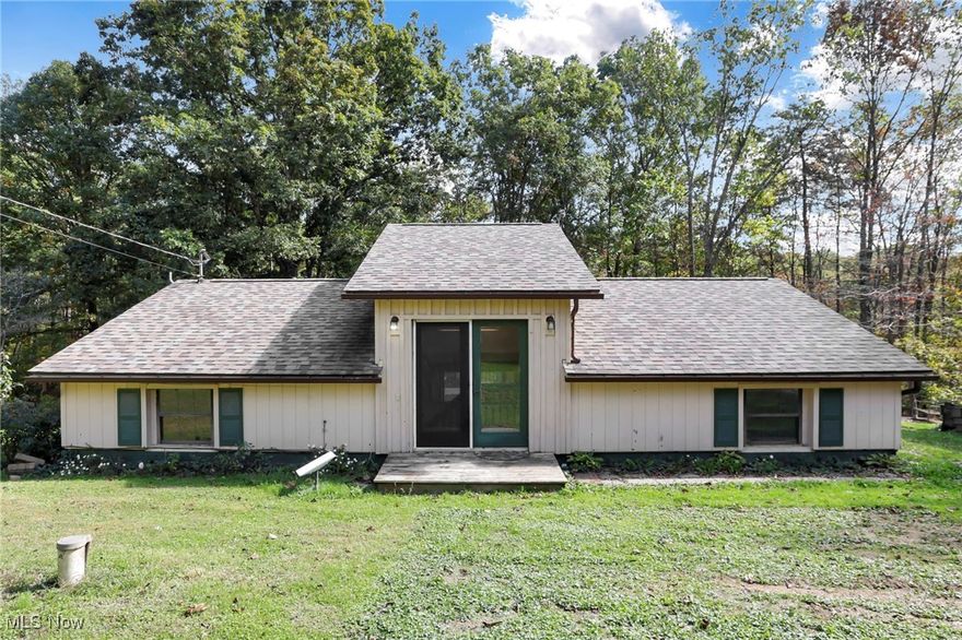 Tucked back a quiet gravel lane, this charming country home offers privacy, space, and tons of updates! Featuring 3 bedrooms, 1 bathroom, and brand new LVP and vinyl flooring, new roof & gutters, new hot water tank, plus HVAC and electrical update. It's move-in ready! Outside, enjoy a fenced backyard, shed-turned-chicken-coop, and mature fruit trees and berry bushes. A tiny home/shop with half bath (formerly used as a salon & grooming space) offers endless potential for a home business or guest space. There's also a second shed prepped for a wood stove, perfect for a workshop. Quiet, private setting with room to grow. This is a unique find in the Warren Local School District.