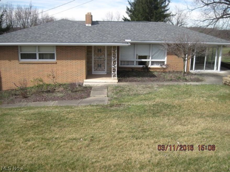 MOVE RIGHT IN.  Lovely 3 BR brick ranch with 2 W/B fireplaces - 1 in LR and l in Rec Rm.  Breakfast room (bonus room) off kit with  pantry leads to
nice sun room.   Finished rec room also has built-in shelving and patio doors to rear patio.  Second bath and 2 car garage in basement.  Security system
and paved drive.  Roof, furnace and A/C all under 5 years.   Move in condition.