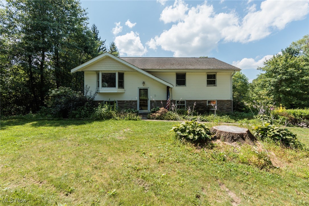 18400 Shaw Rd is ready for you to bring TLC, your dreams, and ideas to this solid 3 bed-1 bath Bi-Level home. This home offers 2 floors of living, attached 2 car garage which opens to lower level with wood burning stove for cozy evenings. Kitchen, all bedrooms, and bathroom are upstairs where you'll find a slider to a private serene enclosed sunroom with ceiling fan. Walk out to your deck overlooking lush perennials, and landscaping. This home has permission for building on this 1.5 acre parcel. 18400 Shaw Rd has a Chagrin Falls mailing address, but is physically in Auburn Township and a stones throw from stunning LaDue Reservoir and State Wildlife Area.
Great bones - ready for updates or add on to increase the footprint of the home or start fresh.
This home is being sold 'as-is' and sellers are not in position to make any corrections.