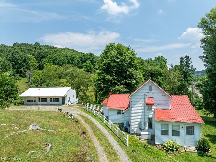 Beautifully maintained property centrally located between New Phila and Atwood Lake. This property has been impeccably maintained by the current owner for over 30 years. It is situated on 9 partially fenced, partially wooded acres. There is the original updated farmhouse that has 2230 square feet, a 26x40- 3 car garage with a walk out lower level, a 24x40- 2 car garage with an attached carport and attached barn in the back, and a hen house. The house has a main floor master bedroom, bath, and laundry.  The eat-in kitchen has lots of custom built-in cabinets and includes all the appliances. The living room has a gas fireplace, and the family room has a free-standing gas stove. There is a new metal roof, an updated septic system, a newer gas furnace with central air, updated 200 amp electric and a Generac whole house generator. Monthly utility averages are very reasonable with AEP Electric-$114, AIM Energy Gas $22.00, and Kimble trash at $80/every 3 months. Spectrum cable for high-speed internet. The seller is retaining the mineral rights.