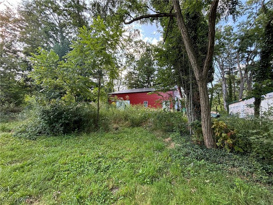 Bring your ideas and plans to this 2.05 acre lot.  40X60 Pole building and a garage with electric. 100 amp in garage and barn.
Well and septic on the property (Condition unknown). Shared driveway.
Do not walk the property without an agent. Camera's on the property.