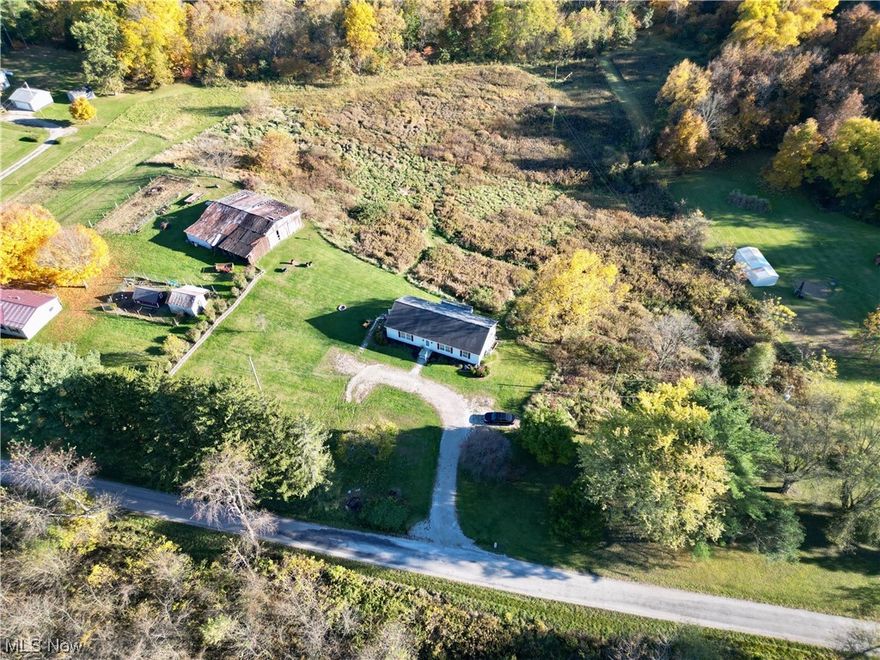 One-Owner Ranch built in 2010 is situated on 4.93 acres~Now priced lower than appraised value due to Sellers moving~Country views that provide a sense of space & freedom while desired amenities are moments away-just a short distance off I70/RT40. Sturdy construction and thoughtful layout design blends comfort and opportunity~Potential for Multi-Garages! Master Bedroom & Bath conveniently next to 1st Floor Laundry with exit to the side yard, making daily chores a breeze. Two additional Bedrooms along with additional Second Full Bath located on opposite side of Master. Excellent insulation: 6-inch walls upstairs and 9-inch poured walls in basement. The entry drive to this home provides ample space for extending into a horseshoe driveway~imagine the possibilities~from enhancing the property's curb appeal to adding a garage for additional storage and convenience. Choose your own color theme! All-white walls offer a blank canvas, ready for your personal touch and design style. Spacious front and side yards, perfect for gardening, outdoor activities, or entertaining. There's room for your imagination to run wild, from a garden oasis to a play area for children and/or pets. Text or Call to schedule a Showing to discover how this Home provides the perfect balance between tranquility and convenience, with endless potential and a welcoming atmosphere, it's a place where you can truly make your dreams a reality. Don't miss this opportunity to experience the best of both worlds.