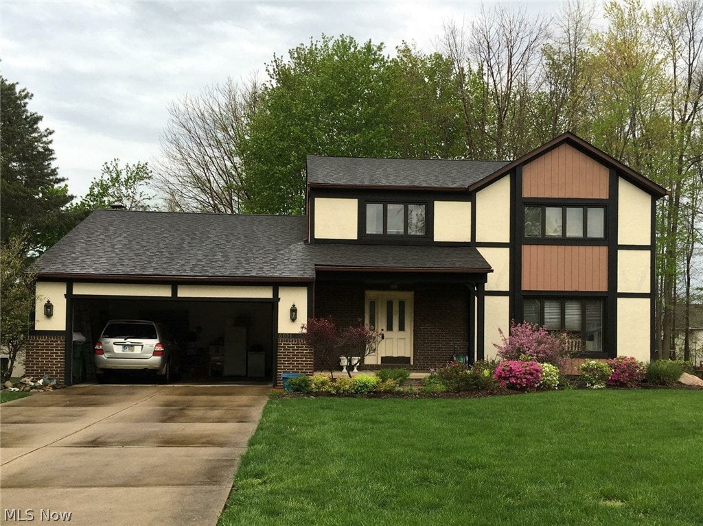 Take a look at this hidden gem. This handsome 2 story Colonial/Tudor style home boasts 4 bedrooms and 2 and a half baths with ample storage space throughout the home. Your formal living room has original woodwork built-ins and crown molding with French doors leading into the foyer. The kitchen has a farm house look and granite countertops as well as bar seating and a built in desk. The open concept lets you view from the kitchen all the way through the dining room to the family room. In your family room, you have a nice gas fireplace with a stately mantel and a beautiful 3 panel door to the concrete patio. If you head upstairs, you will find 3 nice size bedrooms and a spacious master bedroom with en-suite bath. Take a dip in your private whirlpool tub to soak your troubles away.
Large open finished basement has unlimited possibilities! This home has great bones and is priced to sell! Home warranty included.