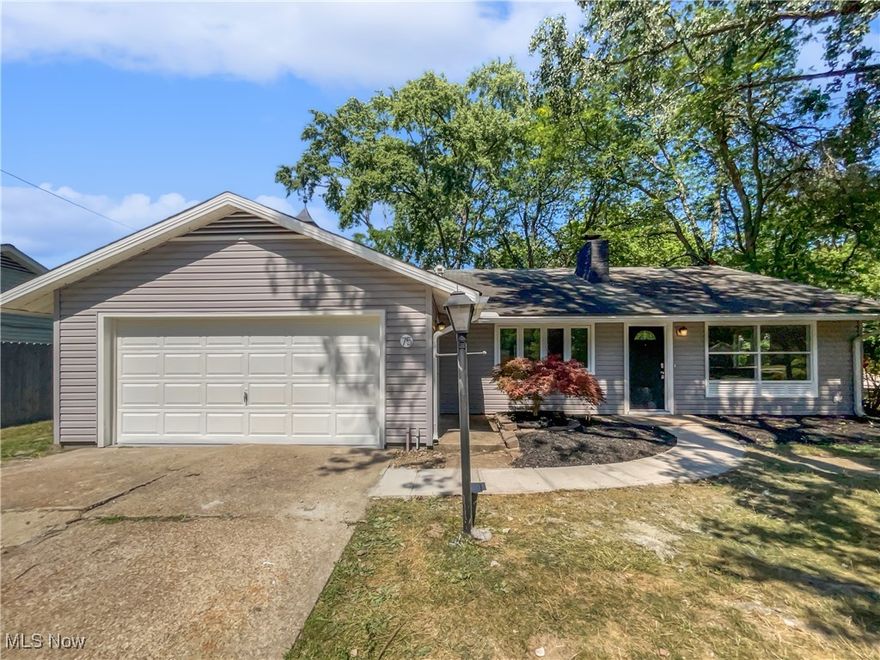 This beautifully updated single-level ranch offers 3 bedrooms, 1.5 baths, and a spacious layout. Step inside to find fresh updates throughout, including new shaker-style kitchen cabinets, sleek countertops, stainless appliances, and updated flooring. The modern living area features a fireplace, creating a warm and inviting space for relaxing or entertaining. Each bedroom offers ample space, and the updated bath adds a touch of modern convenience. Situated on a large lot, there’s plenty of room to enjoy outdoor living, gardening, or a good . A 2-car garage adds extra storage and functionality. With its tasteful upgrades and classic ranch layout, this move-in ready home offers both charm and comfort in a desirable setting... 100-Day Home Warranty coverage available at closing