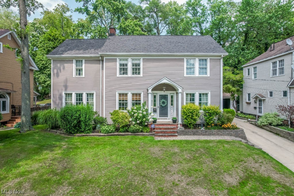 This stunning colonial home has graced the pages of several National magazines for its timeless design & craftsmanship! As you step inside, you'll be amazed by the stylish interior showcasing the quality construction from the past. The grandeur begins with the elegant dining room accented by crown molding & a chair rail setting the stage for unforgettable gatherings. Beautiful hardwood floors lead you through the foyer to the living room where a wood-burning fireplace takes center stage. Open the French doors to the sunroom, a relaxing spot that provides direct access to the outdoors. Working from home is a joy in the designated home office thoughtfully designed with built-in bookcases on each end for storage & display. The guest bath with a pedestal sink is tucked in the hall leading to the delightful kitchen featuring quartz counters, charming farmhouse sink, tall cabinets, & modern stainless steel appliances. Upstairs you'll find 4 well-appointed bedrooms each with its own unique ch