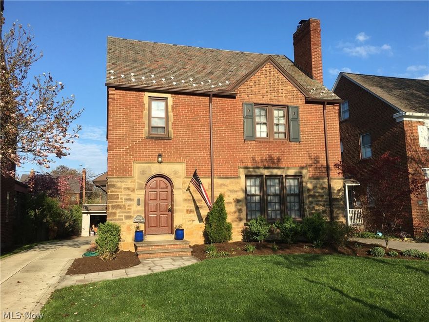 Welcome to this beautiful 3-story brick, 4 Bedroom, 2.5 Bath Colonial Home in University Heights! Look at the Living room with a stunning picture window letting the sunlight flood in and a lovely fireplace. The dining room is the perfect place for entertaining and opens into an enclosed 3 Season porch for you to sit on and look at the impressive yard. Thiseat-in kitchen provides a lot of space for a kitchen table and boasts a lot of light from the outside.  Four nicely sized bedrooms, 3 have beautiful hardwood floors and 1 has carpet with hardwood underneath.  basement.  Partial Finished Lower level which is ideal for a theater room or rec room has a fireplace, and extra storage.  Updates Include: New Concrete driveway installed 2013, Gas fired hot water tank installed new 2013, Carrier Infinity Series 96% efficiency two stage furnace installed new 2014, Carrier Infinity Series 24 super quiet air conditioner installed new 2014, Ball valves installed new for all water supply lines in ba