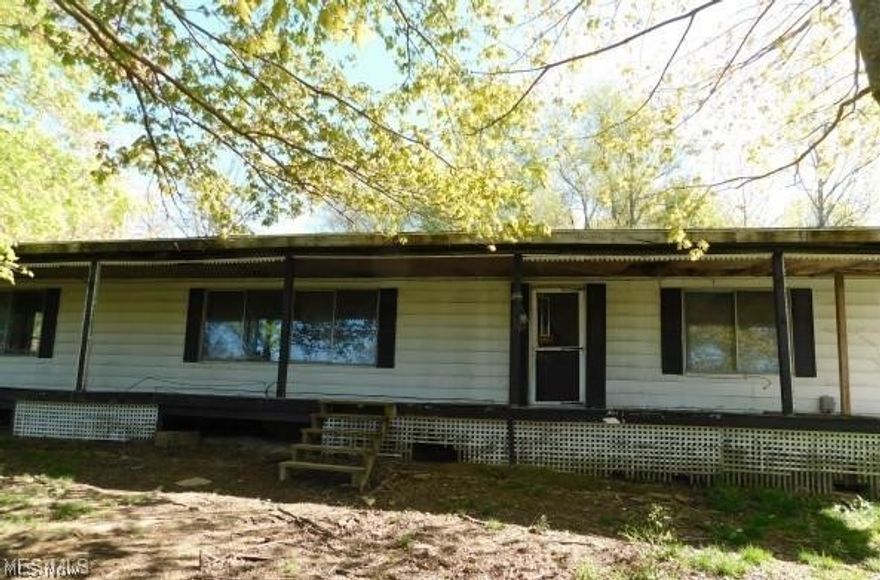 This 3 bedroom, 2 bath home is waiting for someone to come in to make it their own as it has good "bones" and needs some work. It features a laundry area, an enclosed area off the back for a possible workshop with storage. There are a couple of storage buildings behind the main house. There is a mobile home at the front of the property that needs work, but the possibilities are there with some TLC and separate utilities. It is 720 sq ft, 12' x 60'. There is a lot of potential with this 5 acre property with the Salt Fork State Park Region only approx. 5-7 miles away! Earnest money, Proof of Funds or Pre-Approval letters are REQUIRED with all incoming & accepted offers. The property is sold in AS-IS whereas is with all its faults. Seller will not complete any repairs to the property, either lender or buyer requested. Buyer pays conveyance fee.