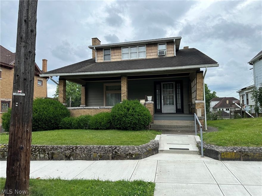 A whole lot of character. this 3 bedroom house has very large closets in the bedrooms and a large closet in the upstairs hall.  formal dining room and eat in kitchen with a breakfast nook. Large living room with fireplace (needs some work), an d foyer with beautiful woodwork . a newer hot water tank. Gravity fed gas heat, some newer concrete sidewalk and walkway around house AND a very new concrete garage that extends longer than a regular garage. check this out.