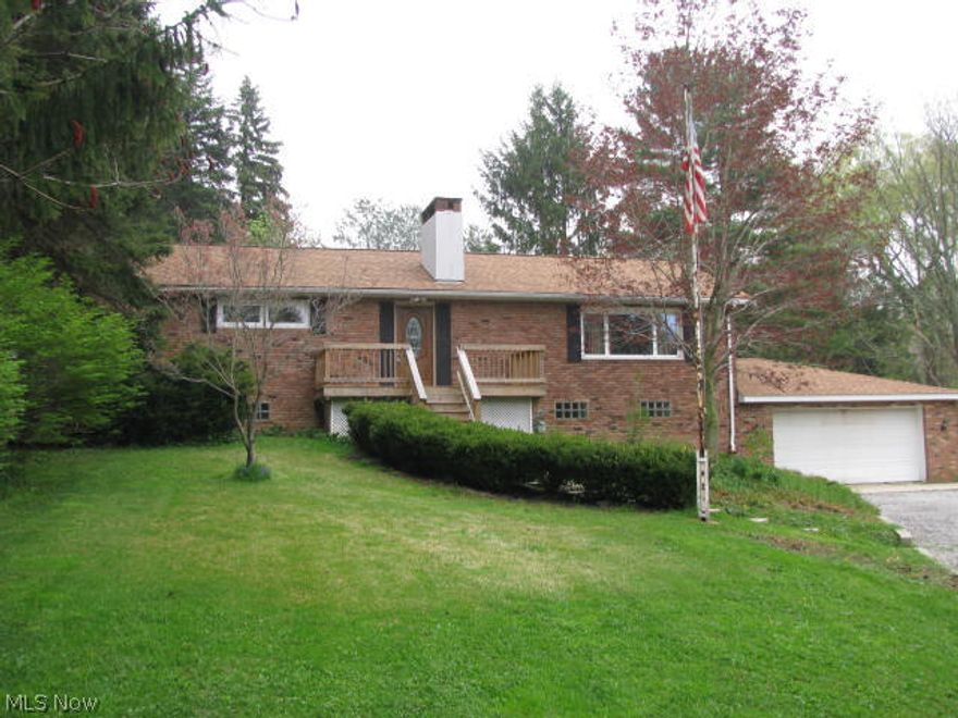 Brick Ranch with Beautiful views has been totally updated. Gleaming Hardwood Floors, New Kitchen and baths, New wiring and 200 amp service, new roof & more! First floor den of kitchen could also be additional dining area or first floor laundry/mudroom. Breakfast area of kitchen has picture windows to watch the deer play. Lower level rec room is easily set up for a wood burning or pellet stove. Gas fired boiler provides economical heat & whole house fan cools. Huge workshop area for the mechanically inclined walks through to oversized attached garage. 32 x 24 pole barn has cement floor& overhead door. Great location near Alpine Valley!