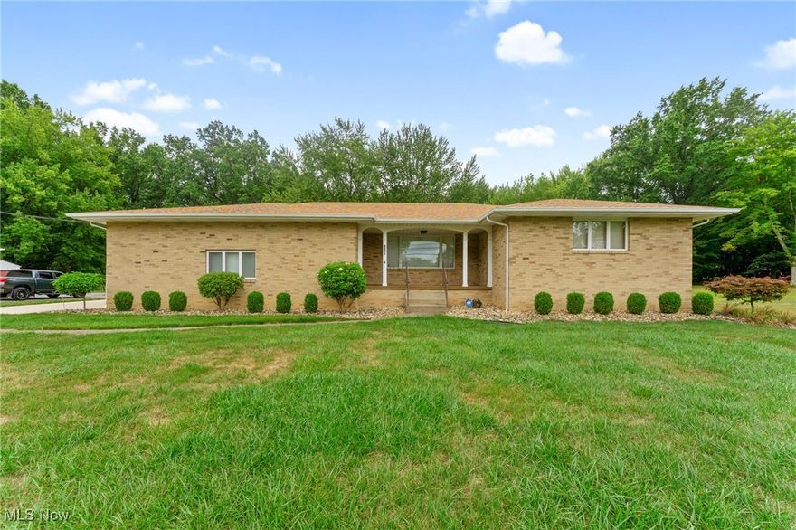 Beautifully maintained brick home sits across from Roosevelt Park in Campbell, OH. The back of the property extends well into a deeply wooded area. You will find original hardwood floors in all of the bedrooms and hallway. The two large bedrooms have ample closet space. The master boasts an en suite half bath that has been recently renovated. The main floor full bath offers double vanity sinks and a spacious walk-in shower. Brand new vinyl flooring is throughout the dining room, kitchen and family room. The spacious family room could easily be converted into a third bedroom with a pristine fireplace and sliding glass doors to a view of the gorgeous backyard and covered porch. There's so much closet space thoughtfully built into this home, storage should not be a concern. The expansive basement supports the entire foundation of this ranch home. It includes a pantry and an unfinished bathroom which could be converted into a bonus bedroom. Schedule your appointment today to view this well-built home!