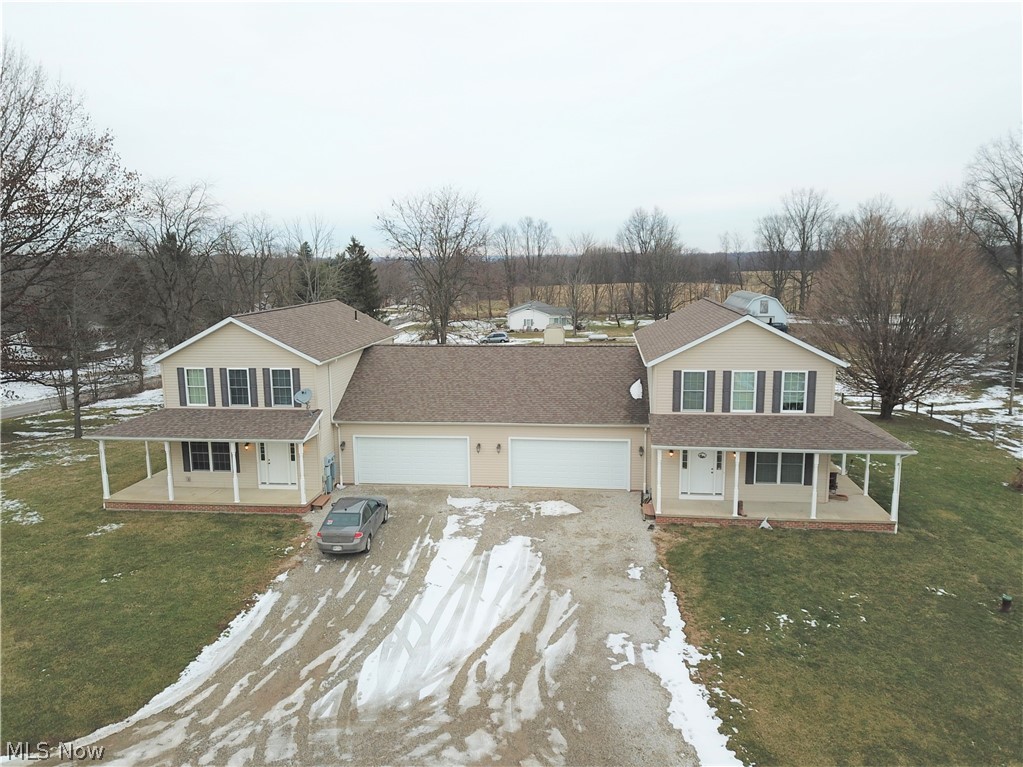 Welcome to 11299 - 11301 Canaan Center Road – a spacious duplex located in Canaan Twp! Custom built by Zollinger Builders in 2007! Each side of the duplex has 3 bedrooms and 2.5 baths. Both eat-in kitchens are extremely large, cabinet, counter, and pantry space won’t be an issue! There are also convenient breakfast bars on both sides with a dining area featuring a slider which opens to a full wrap around porch. Half bathrooms located on the first floor and first floor laundry rooms, which both have cabinets and a sink right off the oversized 2 car garage. All of the bedrooms are located on the second floor with each side having a master bathroom and walk-in closet in the owner's suite and a 2 second full bathroom upstairs. Large basement offers tons of storage space. Norwayne School District. Pictures are of the one side, the other side is a mirrored image. Don’t let this spectacular opportunity pass you by!