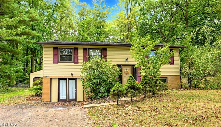 *WELCOME HOME To This Remarkable Bi-Level In Norton On Lullaby Lane In The Desirable Melody Village Neighborhood! *2,080 Sq. Ft. Includes 4 Bdrms, 2 Bathrooms - Upper & Lower Finished Walkout Level! *Oversized 2 Car Detached Garage W/Liftmaster Keypad, Shed, 3/4 FENCED IN YARD On .33 Acres! *Relax And ENTERTAIN On The NEW 2021 Large DECK Which Spans Almost The Entire Back Of Home! *Major Updates Include: LUXURY Plank Flooring 2022, New FURNACE and CENTRAL AIR 2016, Main Bathroom Updated Tub/Shower/Flooring & MORE *Walk In To A Foyer W/10 Ft Ceiling *Upstairs Is The Main Living Rm W/Hardwood Floors & Walls W/White Beadboard Accents  *The Dining Rm Features A New Modern Remote Controlled Hunter Ceiling Fan & Door To The New Back Deck *Kitchen W/Appliances, Above Sink Track Lighting & Cabinets W/Lazy Susan *3 Bdrms Main Floor Include 1 W/A Remote Controlled Ceiling Fan & Another W/Dimmer Light ~ Cozy Carpet *Full Main Floor Bathrm Boasts LUXURY Plank Flooring, Built in Linen Closet + Vani