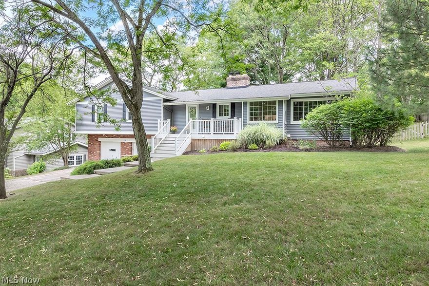 This elevated ranch is about 1 mile from the Historic Village of Chagrin Falls and located on a quiet cul-de-sac. Renovated kitchen with quartz counters, soft close drawers, all stainless appliances, marble backsplash and "bump out" for breakfast area overlooking scenic front yard on top of the hill! The family room is versatile in its space and could be used as dining room if desired! Vaulted main living area with 2 story brick fireplace and oversized hearth, with views of the private, wooded lot is ideal for entertaining! Updated full baths with quartz countertops.  Ensuite Master bath has full glass shower enclosure, dual sinks and heated floors. Main hall bath has vanity and quartz counter! Bedrooms have generous finished closets. Roof & vinyl siding (great color!) in 2016, Windows in 2015. Brazilian cherrywood floors in kithen, family room and foyer in 2019. New fence 2018. Finished walk-out lower level with rec room and fireplace. Ideal for recreation! Rear patio and private, fenced yard! New windows, roof and siding in the past 8 years. Oversized 2 car gar with ample storage! Convenient to Chagrin's Falls, shops, grocery, restaurants, movie theatre and dog park.
