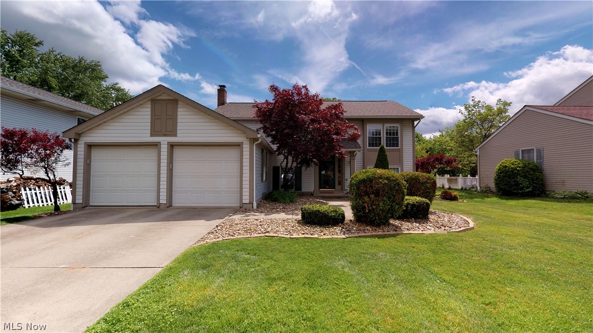 Welcome to this fully remodeled home in the Kelsey Creek Commons. You won’t be disappointed with the updates! In addition to the wonderful design elements that you’ll read below, this home has a brand new roof, AC & furnace in 2018. This modern 4 bed/2 full bath home is truly move in ready! This home features a large custom island in the kitchen, can-lighting in the vaulted kitchen and living room, high-durability dark laminate hardwood flooring in living & dining area, as well as the main staircase, modern light gray tile in the downstairs foyer and laundry room, brand new carpet in EVERY bedroom and the HUGE downstairs living room with a fire place, stunning elevated outdoor patio for entertaining, large finished laundry room with utility sink and extra-large storage closet, and a convenient attached 2 car garage. This home is walking distance to WaterWorks Park & located near the Hike-n-Bike Trail system, minutes away from everything Cuyahoga Falls and just a few minutes from Route