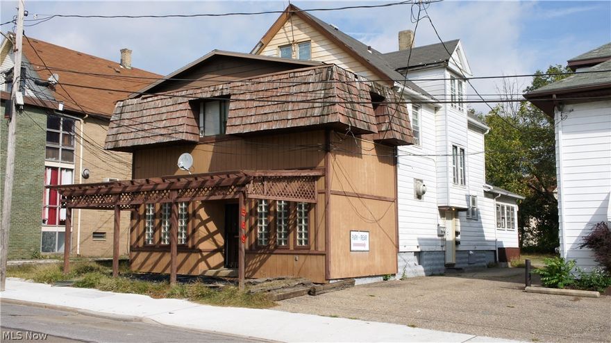 Great investment opportunity! This building has three units and a store front with lots of potential. Great building to run a business and have rental income at the same time. Convenient location to downtown Akron and Fairlawn. Just minutes from the highway. Some utilities are split with tenants.