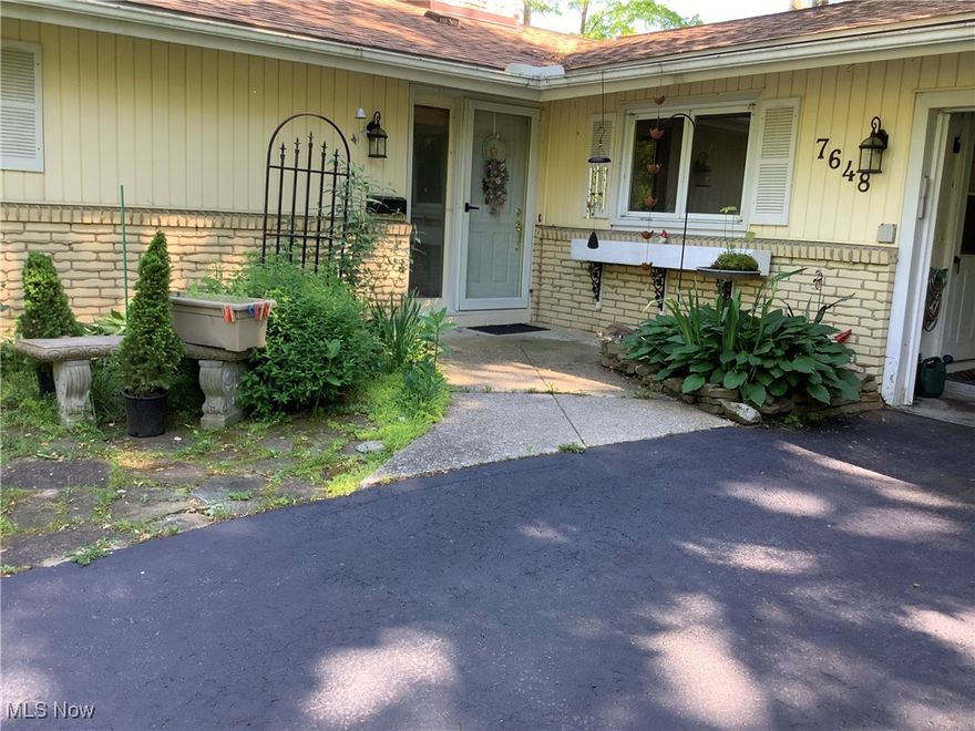 Experience tranquil living in this 3 bedroom 2 bathroom ranch gracefully situated on a peaceful cul-de-sac in Mentor.  This charming home offers a desirable single-story layout enriched by an abundance of natural light and an inviting open concept design that promotes comfort and a seamless connection to nature.   The residence showcases stunning floor to ceiling glass walls spanning the entire back of the home providing the living spaces with sunlight as well as panoramic views of the pond and fountain.  Step outside onto the spacious Trex deck perfect for relaxing or entertaining.  Thoughtfully designed Florida shaker style blinds provide both privacy and security when you're away.  With a touch of creativity and vision this property presents an exceptional opportunity to personalize and elevate an already distinctive residence.  Ideally located near shopping, dining and freeway access this home combines serene surroundings with everyday convenience.
