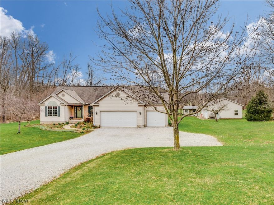 Pride of ownership is evident in this 3 bedroom, 2 bath Ranch style home. The front entry reveals vaulted Foyer and open floor plan with 2-story great room warmed by a stone fireplace, formal dining room, and spacious kitchen provides all appliances and breakfast bar open to dinette area. Master suite connects to glamour bath and walk-in closet, guest bedroom, and bath, with french doors that lead to an office or 3rd bedroom. 1st-floor laundry, vaulted sunroom and a full basement with workshop. Also has a security system, central vac, 200 amp service, and cat 6 wiring. 3 car attached garage plus a 3 car detached garage and "she shed". All this nestled on 5.5 acres, with incredible views of the grounds and a creek from the deck. One year home warranty.