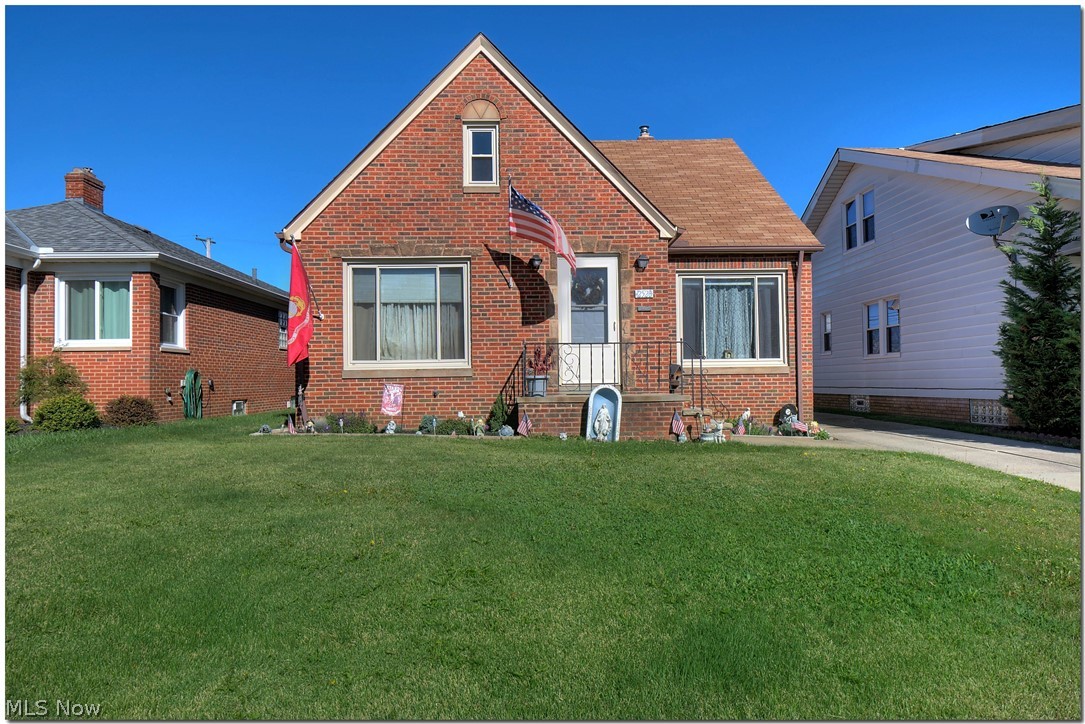 ~Solid Brick Family Starter Home~ Tremendous curb appeal all brick accented with sandstone coins, front walkway and tall gables! Large eat-in kitchen, loads of cabinet space, laminate flooring and peninsula. All new laminate flooring in the living room and hallway! Full bath updated within last 10 years, decent sized bedrooms have hardwood floors. One small finished area up***BUILT-IN-EQUITY! Huge expansive area on second floor can be finished to add additional 400+square feet including large master suite with full bath-stack IS accessible*** Enormous open space in lower level includes a water closet! Glass block windows, all newer vinyl windows, newer roof, two new garage doors, new front entry door. Great value! Come see for yourself...very easy to see. Call today!