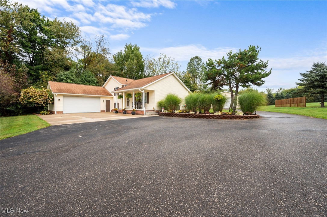 Let’s make it sweet to be home and this one just might be the sweetest surprise tucked between Streetsboro and Ravenna. Located in Shalersville Township, just 15 minutes from Kent this beautifully updated home has been transformed top to bottom over the past five years with thoughtful improvements and stylish finishes that truly set it apart.
Nearly every surface has been touched—fresh paint throughout, all newer lighting, six-panel white doors, closet doors and newer carpet and LVT flooring throughout the home. The kitchen features bright white painted cabinets, appliances that stay (including washer and dryer) and a clean functional layout that makes entertaining or everyday living a breeze. The main bath has been refreshed with paint and the lower-level full bath has been redone with newer flooring, fixtures and finishes—modern, fresh, and ready to go.
The finished lower level adds flexibility and function, offering bonus living space currently used as an exercise/music room. Unlike many split-level homes, this one includes a true basement—complete with a radon mitigation system for peace of mind. The home is wired for a portable generator with most major outlets covered and features a battery backup for the sump pump to keep things dry and protected. The home is electric with a 2-year-old water softener, 3-year-old h2O heater and an ejector pump serving the basement bathroom. Roof is estimated to be 7–8 years old.
Step outside to a freshly painted deck, updated landscaping, and all-new gutters. The backyard offers privacy and a natural buffer of trees that provide both shade and serenity—perfect for relaxing evenings or weekend gatherings. The oversized 22x40 garage is fully equipped with newer lighting and workbenches that stay—ideal for hobbyists, gearheads or anyone needing extra space. All of this sits on a generous 2.19-acre lot, giving you room to stretch out and enjoy!
This home has been lovingly cared for and is truly move-in ready!