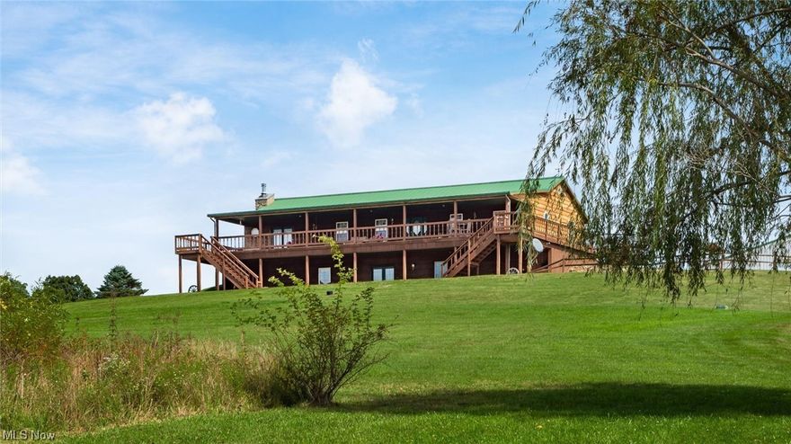 Enjoy your privacy & great views of the pond & rolling hills as a breeze blows by the wraparound front porch. Drive thru Pole Building (2,688 square feet) has room for 6 vehicles, oversized overhead doors, concrete floor, office, & extra garage door lead to more storage. Home has 4 beds, 3 baths, over 3,800 SQ FT of finished living space, & 13 acres. Eat-in kitchen with island, 3 sinks, tile on floor, counters, & backsplash, & plenty of cabinet space. Living room has hardwood floors & electric fireplace. Dining room has hardwood floors. Main floor has 3 bedrooms & guest bath. Main bedroom has 2 closets & private full bath with marble floors. Lower level has walkout covered patio, wet bar, family room with woodburning stove, 4th bedroom, full bath & sauna. Acre pond has shelter house.