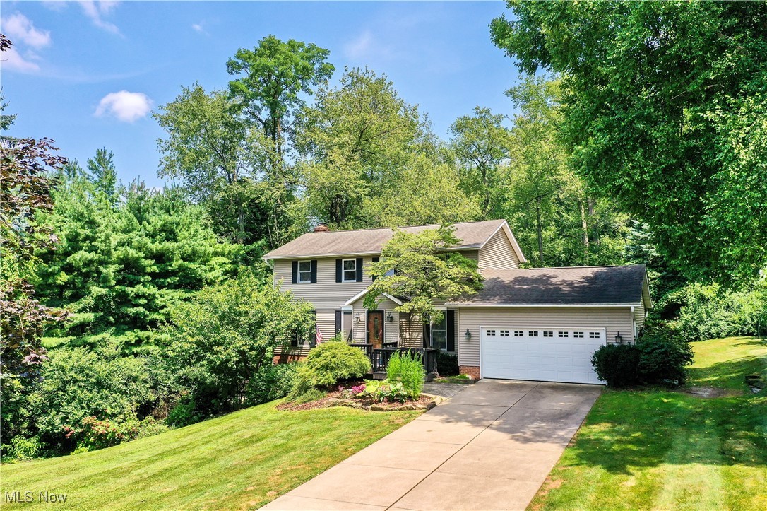 Welcome to 1236 Spring Valley Ave – a stunning 4-bedroom, 3.5-bath home nestled on a serene, nearly 1-acre wooded lot. This rare find offers the perfect blend of privacy and space, ideal for both everyday living and entertaining. The beautifully landscaped backyard is a true retreat, featuring two spacious decks, a charming brick fireplace, a screened-in gazebo, and a well-maintained storage shed for all your outdoor needs.
Step inside to discover a thoughtfully designed main level with gleaming hardwood floors, a dedicated home office with custom built-ins, a convenient first-floor laundry room, and an updated kitchen equipped with modern stainless steel appliances. The open-concept layout effortlessly connects the kitchen, dining, and living areas, creating a warm and inviting atmosphere.
Upstairs, you'll find four generously sized bedrooms and stylishly updated bathrooms, offering comfort and functionality for the whole family. The finished walkout basement adds even more living space, complete with luxury vinyl plank and new carpeting, a fully renovated full bath, a bar area, and a cozy fireplace—perfect for movie nights, game days, or hosting guests.
This move-in-ready home checks every box. Don’t miss your opportunity to own this peaceful, picture-perfect property!