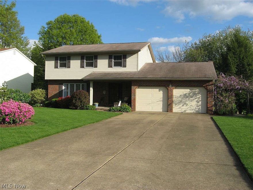 Beautiful well-maintained home with many updates.  Including a custom maple kitchen, with granite countertops, informal eating area near a serving island open to a bright family room with wood burning fireplace.  Gorgeous updated baths with quartz or granite countertops.  Nice master suite plus three additional bedrooms.   Craft room in basement offers an additional 126'.  Awesome work room in basement as well.  Lovely spacious multi-level composite deck with awning and gas grill overlooks a beautifully landscaped yard. See list of updates under additional docs.  Home Warranty included.