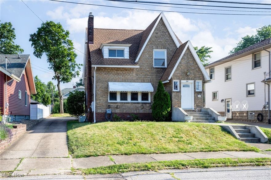 Welcome to 289 E Baird Ave Barberton~Versatile Brick 4 bed 2.5 bath family home offers so many options. First floor includes spacious living room w/refinished wood floors, charming archways, lots of natural woodwork, vestibule, and fireplace, formal dining, kitchen and basement access where there is a half bath and laundry. Second floor find 4 bedrooms 2 baths and new flooring. The upstairs floor plan allows it to be used for an in-law suite with living room that includes wood floors and gas fireplace, its own access, kitchen and bath. Bonus rooms on 3rd floor with wood floors. 3 car garages - one attached and two detached with new siding makes parking easy for additional family or teens. Close to hospitals and shopping. Check out this charming colonial today to see what options work best for you at 289 E. Baird Ave Barberton!