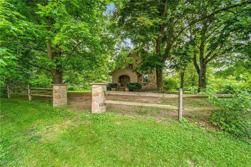 A charming and updated, stone cottage-style home in a great location! This home boasts 3 Bedrooms and 2 Bathrooms and sits on a secluded .898 acre lot with the convenience of living in town. First floor has a bedroom, currently used as office, and a beautiful full bathroom with heated tile flooring! Kitchen features hickory cabinets with new LVT flooring throughout. Second floor has 2 bedrooms and a comfy sitting room. The property contains a 4 car garage, currently being used as a 2 car with a heated man-cave. Updates include new LVT flooring (2021) metal roof with gutters and down spouts (2020).