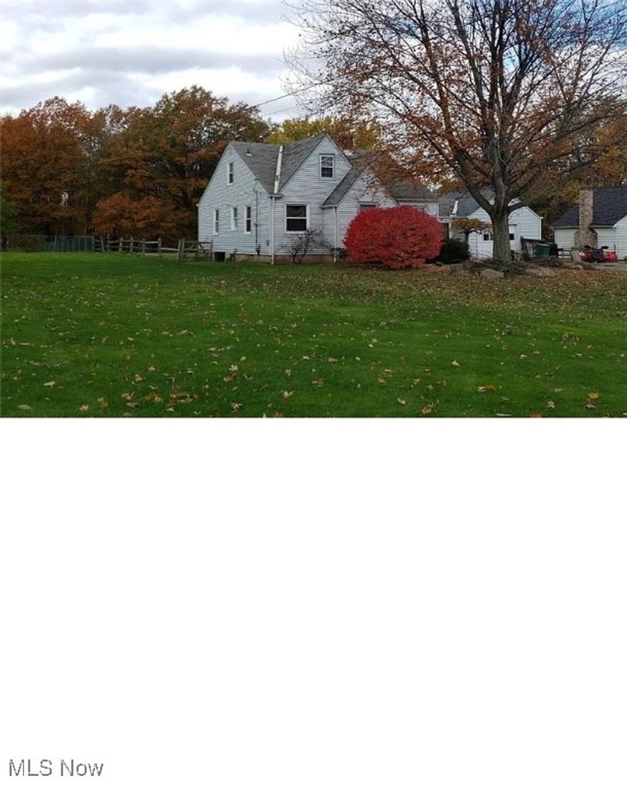 Looking for an affordable house in a nice neighborhood? This solid bungalow has all you need: prime location just steps from everything, contemporary floor plan, plenty of space with 3-4 well-sized bedrooms, large concrete patio overlooking a natural forest with mature trees in the backyard. The house comes with 4-season room, 2 car garage with concrete driveway, and bone-dry basement with laundry. The house features true hardwood floors on both levels and nice expensive tiles in the kitchen area and they are in perfect shape. Kitchen cabinets are good and can be kept as well. The garage connected to the house via breezeway. Newer windows, roof, and mechanicals. The house needs painting and a clean-up but is priced accordingly.