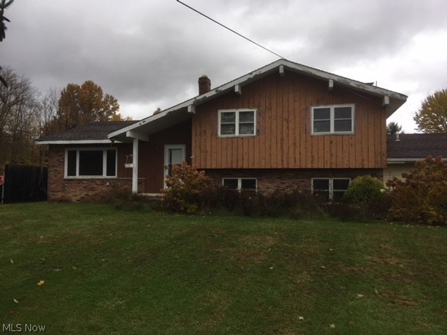 Handyman special ... needs significant work, updating yet great upside and very nice setting!

Split level design with sprawling layout. Large addition was once added to the west side and the original garage was converted into living space. 5 bedrooms, 4 full bathrooms, vaulted ceilings and approximately, 3,400 square feet of living space. Basement, two separate HVAC systems and wood burning fireplace with brick wall, matching mantel and hearth. Lots of getaway space with two sets of sliding doors accessing a courtyard. Good opportunity for a large family, in-law suite arrangement, or home-based business. 

Detached garage with 4 bays and extra storage. Situated on 5.92 rolling acres with tall pines, plenty of play area and private space.