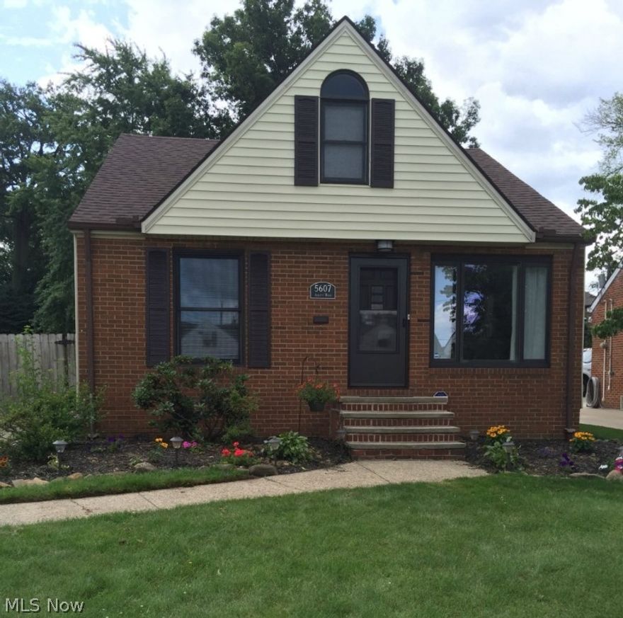 Enjoy old neighborhood charm with modern updates and improvements throughout this classic Parma Bungalow.  The neutral and clean color palette flows through the entire home.  With two first floor bedrooms, and a main floor updated bathroom, this home will be suited for easy family living.  You will enjoy the modern kitchen with all new stainless steel appliances.  An attached dining area makes family meals warm and friendly.  Upstairs boasts a large bedroom and a walk in closet with ample dormer storage perfect for your additional needs.  The partially finished basement offers a large recreational space or office area with easy access to a full bath.  A large laundry and utility area are perfect for your storage needs.  You will enjoy the privacy of your large fenced yard and mature trees.  With a two car detached garage with opener, and easy access to interstates and nearby shopping area, this timeless, yet modern home, is a must see!