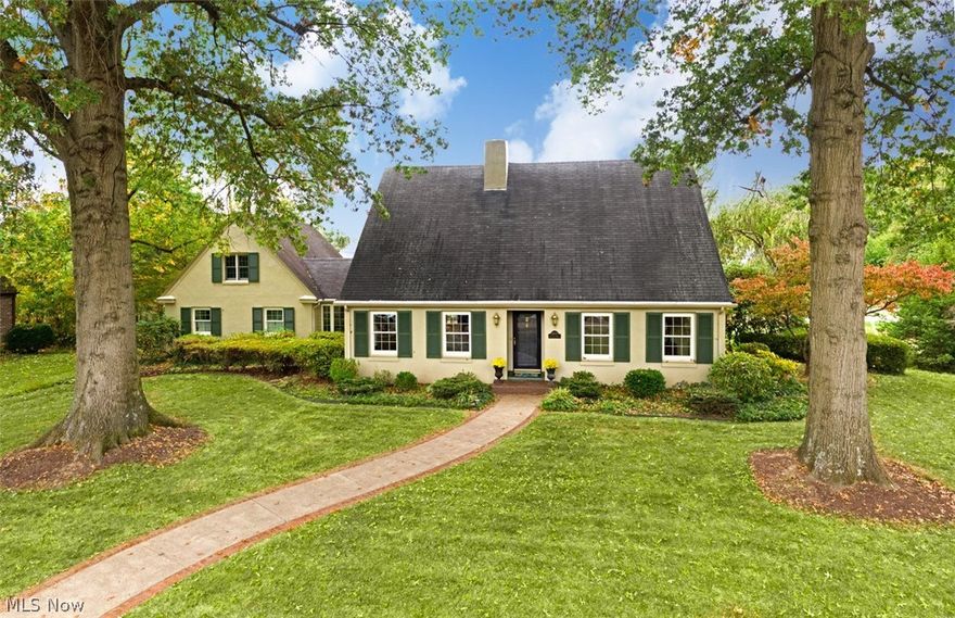 Enjoy COUNTRY CLUB amenities within walking distance of this LIFESTYLE residence. Versatile floor plan that accommodates one floor living or an active family. Sited on two lots with generous front and stately trees that give a sense of arrival and timeless style. The lovely facade features the enduring quality of hard coated plaster and EUROPEAN architecture. Inviting entry hall is enhanced with hand painted strie, traditional staircase and hardwood floors that lead to well planned modern living. A gallery, half bath, a fireside living room, and family room are featured on the main level. Monochromatic custom cabinetry and walls compliment an open light filled kitchen with center line island and dining bay that opens to raised terrace. The generous owners wing with abutting study is a retreat with dual hand painted vanities and soaking tub. Upstairs are two guest rooms and full bath. Above the two car garage, is a guest en suite with private entry. The morning room serves a side approa