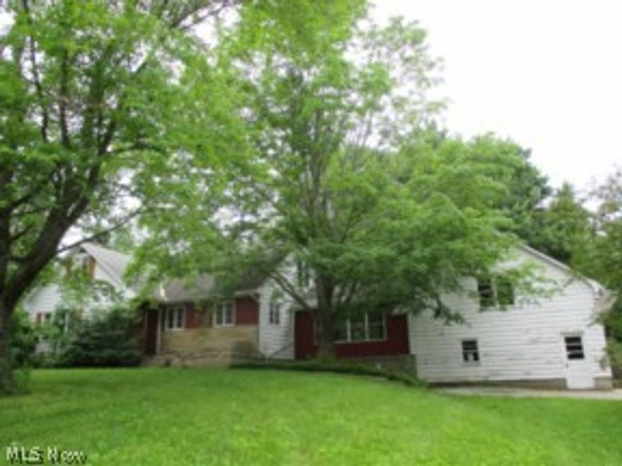4 bedroom colonial home located on almost 11 acres...home features breezeway with knotty pine paneling...livingroom has has a fireplace and there is also a fireplace in the basement family room for cozy warmth on chilly evenings.  Attached garage has second story storage area.  Cute barn style shed and also a 40x24 pole barn.