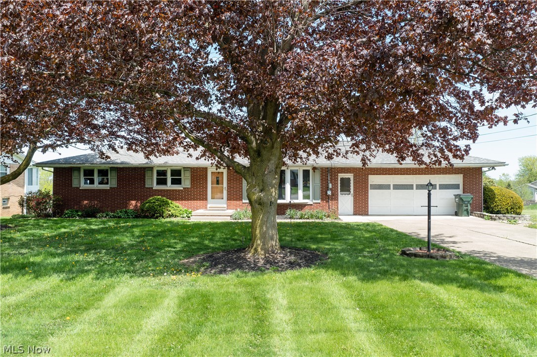 Motivated seller, septic system to be replaced. Solid brick ranch in Nimishillen Twp. - Louisville Schools-Pleasant Acres Allotment! This lovely home is on a .50-acre lot on a dead-end street; it has three bedrooms and 1.5 baths on the first floor and an oversized 2-car garage! The spacious living room has a large bay window with abundant natural light. The eat-in kitchen offers laminate flooring, a breakfast bar, a pantry, appliances, and a dinette area with a convenient laundry chute and a bay window overlooking the lovely backyard and lake. The lower level is partially finished with a rec room with a wood-burning fireplace and a walkout to the enclosed porch/patio, perfect for gatherings and relaxing with family and friends. The other half of the basement offers a spacious bathroom with a walk-in shower, laundry area, glass block windows, and plenty of storage space! One of the best-kept secrets in Louisville with its private fishing lake in the neighborhood! Annual membership inclu