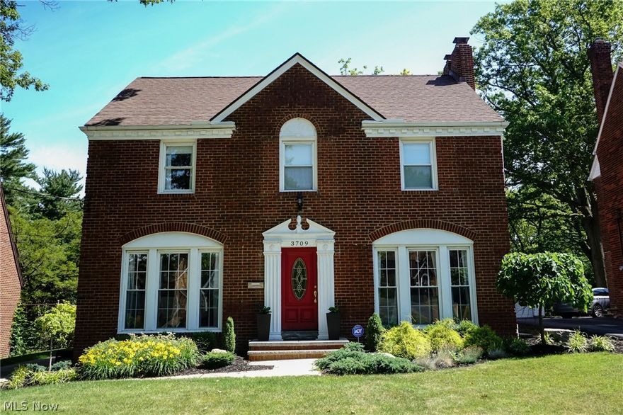Welcome home to 3709 Washington. This beautiful brick colonial in University Heights features all of the charm from a traditonal colonial with updated modern touches. As you walk in the front door you are greeted by gorgeous original hardwood floors throughout and an abundance of natural light. Downstairs you will find a large living room with floor to ceiling windows and a working fireplace. As you make your way to the kitchen, pass through the formal dining room which also has floor to ceiling windows. The updated kitchen boasts granite countertops, stainless steel appliances and a breakfast bar. Off the kitchen is a half bath and access to the backporch. Upstairs are 3 spacious bedrooms with the master bedroom connected to the main full bath. Enjoy morning coffee on the upstairs balcony overlooking the large backyard. As you make your way up to the third floor there is a finished attic/4th bedroom with the second full bath-this space makes for a great guest room, office space, kids