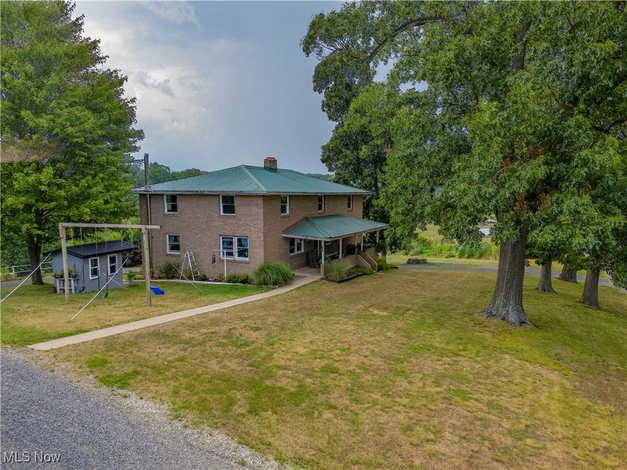 Located just minutes from Walnut Creek, Sugarcreek, and Dundee, this 2.2-acre property offers a blend of comfort and convenience. The spacious 8-bedroom, 3-bath home features newer windows, an open-concept kitchen and dining room, and a generously sized living room perfect for gatherings. Enjoy the outdoors from the charming front porch or the scenic view from the back porch, and take advantage of the walk-out basement for additional living space or storage. The property also includes a barn with a work area and a 24 x 60 shop with a wood burner, making it ideal for both hobbyists and those seeking a peaceful rural retreat. Note: Parcel number reflects total acreage owned, price reflects acreage selling.