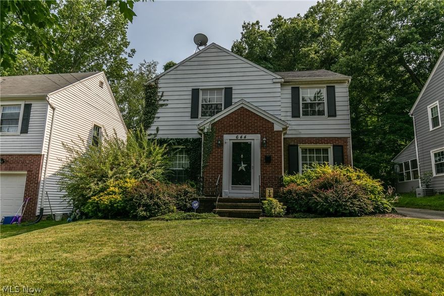 An exceptional West Akron center hall colonial with over 1860 square feet of total living space.  This home features a finished basement and a large 2 car garage.  A 23x12 living room has a fireplace and natural wood floors.  The natural wood floors flow throughout the formal dining room, and the bedrooms.  .  The eat-in kitchen has been updated.   There is a bonus room/office and a screened porch on the first floor.  Each of the bedrooms is nice sized.  The finished lower level features a 23x11 rec/family room, with ample storage remaining.