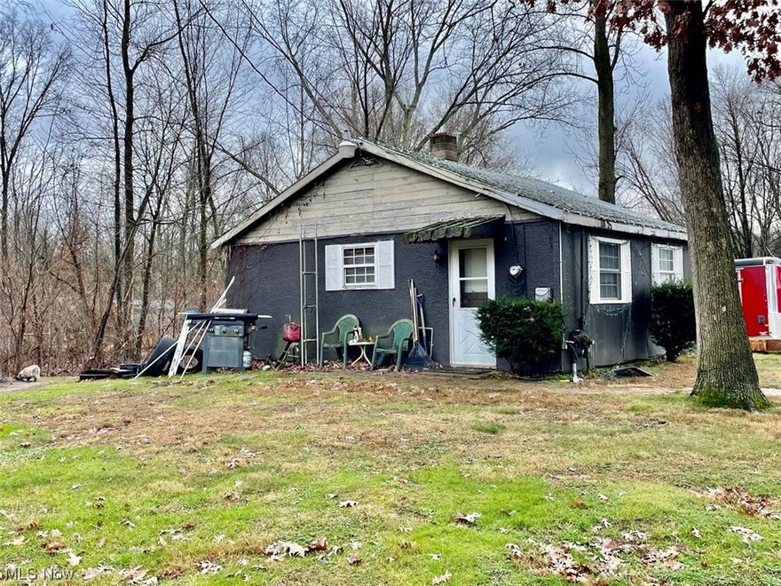 Micro Ranch Home Situated On 8.14 Acres - Great Investment Opportunity – Mostly Wooded - Summit County – Springfield Twp. – Springfield LSD - Live Auction with Online Bidding. Family inherited property. ABSOLUTE AUCTION, all sells to the highest bidder on location. ONLINE BIDDING BEGINS TUESDAY, FEBRUARY 6, 2024 – 12:00 PM and AUCTION LIVE ON-SITE BIDDING WILL BEGIN FRIDAY – FEBRUARY 9, 2024 – 12:00 PM. Real Estate: Summit County parcel #5110990 features a ranch home situated on a nice 8.14-acre wooded lot. The home was built in 1948 and has approx. 528 sq. ft. Main level has a living room, kitchen, one bedroom, full bath, gas wall heater, well & septic (public water available at the street), and a partially started basement. This home is currently rented for $600 per month. The property also has a single wide 2-bedroom mobile home that was previously rented and is now vacant and in need of some repairs. Real estate half-year taxes are $1,104.66. Great investment opportunity! The home will be open on auction day starting at 10:30 AM. Walk the land with permission only. Terms On Real Estate: 10% down auction day, balance due at closing. A 10% buyer’s premium will be added to the highest bid to establish the purchase price. Any desired inspections must be made prior to bidding. All information contained herein was derived from sources believed to be correct. Information is believed to be accurate but not guaranteed.