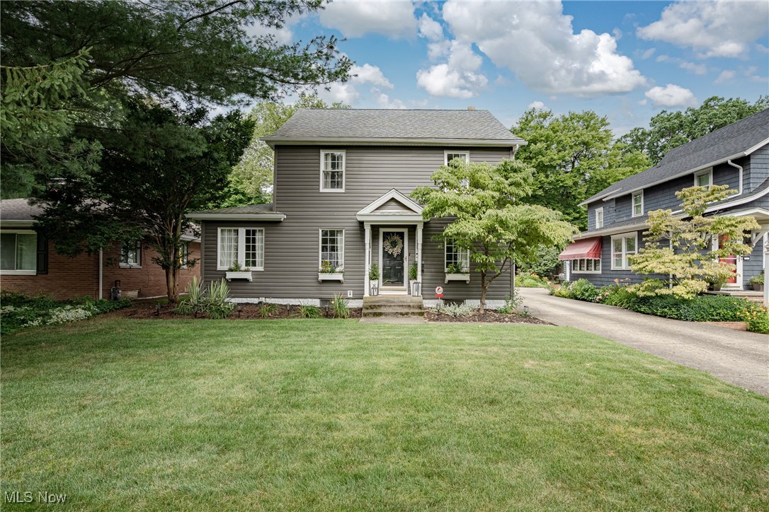 Welcome to 284 Kenilworth Drive – A Charming Colonial Nestled in the Heart of Northwest Akron!
Set on a quiet, tree-lined street, this beautifully updated home offers timeless curb appeal and inviting spaces throughout. Step inside to a spacious living room filled with natural light, built-in shelving, and stylish LVP flooring that flows seamlessly into the formal dining room—perfect for gatherings and everyday living. The updated kitchen features stainless steel appliances, modern cabinetry, LVP flooring, and a crisp tile backsplash, blending functionality with classic charm. Just off the dining room, you’ll find a sunny and cheerful sunroom with a full wall of glass and sliding doors that open to the backyard—your perfect spot for morning coffee or summer relaxation. A cozy office or sitting room with a huge picture window and wall-to-wall built-ins provides the perfect space to work or unwind. Upstairs, three generously sized bedrooms include a primary suite with its own full bath and ample closet space. A finished third floor offers a versatile fourth bedroom or bonus space. The lower level includes a laundry area, half bath, and plenty of room for storage. Enjoy the outdoors from the lovely back patio, ideal for entertaining or relaxing in your private yard. With vinyl siding and numerous updates throughout, this move-in-ready colonial is brimming with charm, comfort, and character. Don’t miss this one!