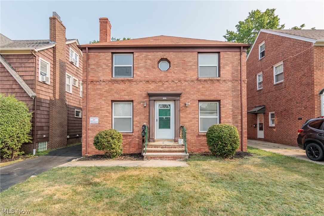 Check out this solid, spacious, all-brick two-family home in University Heights, the City of Beautiful Homes. The tidy upper unit was recently refreshed and ready for an owner-occupant to enjoy or for increased income as you expand your investment portfolio. Each level has 2 bedrooms, a full bath, a dining room and a living room. Enjoy the classic aesthetics of natural hardwood floors throughout, neutral finishes, and accented by a decorative fireplace with charming built-ins. Relax in all-season comfort with central air and efficient vinyl windows. The upper and lower floors have similar layouts. The second floor features an upper porch above the first floor sunroom/mud room. Downstairs is on a $900/month lease with long-term tenants. Upstairs has a more updated bath and could draw higher rents. All kitchen appliances in both units convey with the property along with two washer and dryer sets. In a prime location, this home is convenient to Case Western Reserve University, Cleveland Clinic, and University Hospitals as well as John Carroll University. Home to be delivered University Heights point-of-sale compliant. Schedule your showing today!
