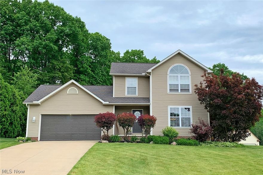 Beautiful, colonial style home with three-bedrooms and two and a half baths, situated at the back of Hidden Knolls subdivision in Rootstown township. Well cared for original-owner home. The first floor has an open eat-in kitchen w/slider leading to the back deck, spacious family room, foyer entryway, a half bath and first floor laundry! Three bedrooms and two full bathrooms upstairs including the master suite with walk in closet and private bathroom. Full dry basement – great area for a rec. room! Nice corner lot, nearly a half an acre with a nice sized side yard! Two car attached garage with concrete driveway. Mature landscaping. Public water & sewer. Rootstown schools. Move-in ready. Schedule your showing today!