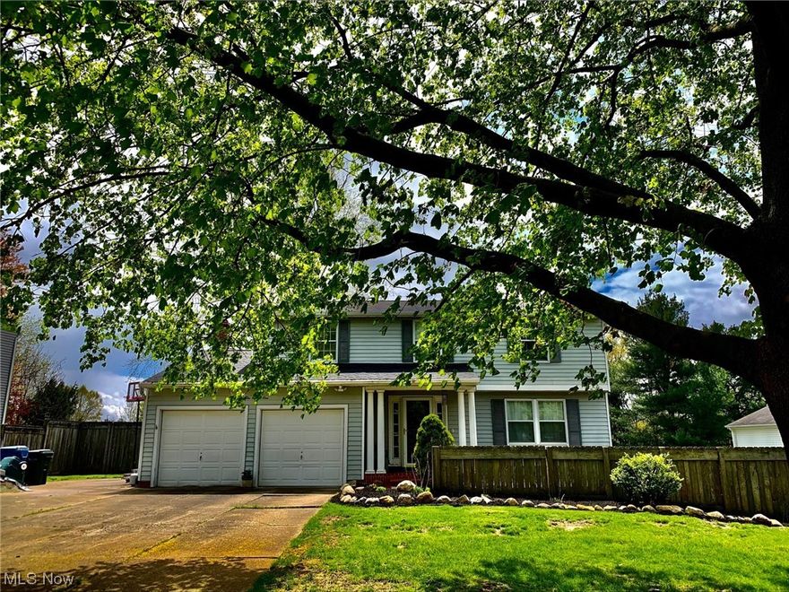 Welcome Home! Fantastic location very close to Green LSD, shopping, restaurants, parks, golf, & only a couple minutes from portage lakes & boating & so much more. A beautiful colonial home with 4 beds,2.5 bath with newer Anderson windows! On the 1st floor there is a formal living & dining room, half bath, a spacious eat in kitchen that opens to family room with a brick wood burning fireplace. Off the family room is a huge bonus room which features its own separate new a/c & furn (2019), cathedral Brich wood ceilings, ceramic tile, hot tub, 3 new Anderson sliding glass doors that open up to the new patio & beautiful backyard landscape with perennials & has 2 storage sheds. Upstairs you will find 4 spacious bedrooms, & 2 full baths. The master suite includes a private full bath, 2 closet one is a walk-in closet & a built in vanity for make-up. The basement is partial finish with a rec room, tons of built in for storage along with a wet bar and space for a wine fridge. There is a pulldown