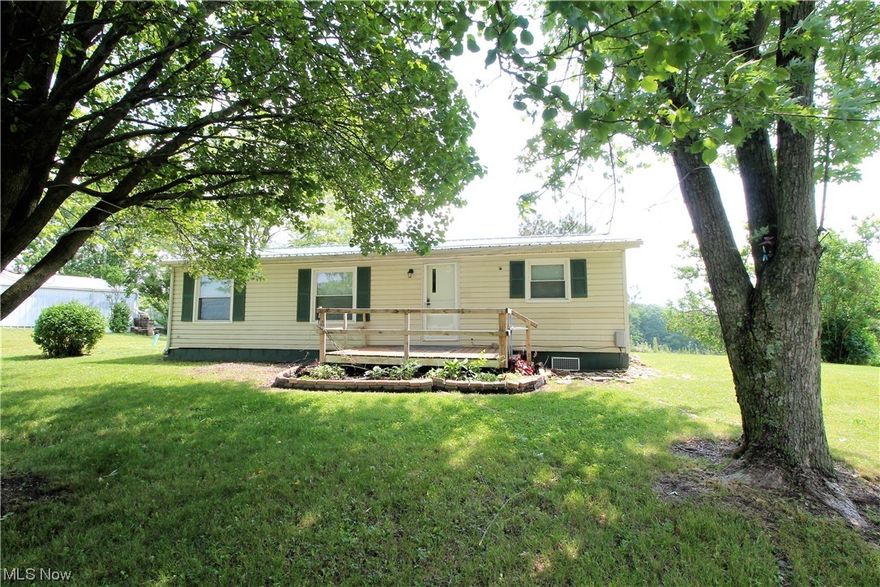 Scenic views! Welcome to this three-bedroom, two full bath ranch style home. Come on in from the front porch into the large living room. The eat in kitchen has a built-in hutch, plenty of cabinets, stove and refrigerator. Laundry area. Master bedroom has full bathroom with new flooring. There are two more bedrooms and a full bathroom. The large, gorgeous backyard has plenty of room to sit out and enjoy or entertain family and friends. Ready to move in!