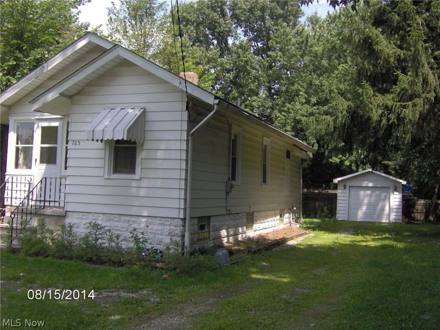 Nice Yard, walkout basement, enclosed front porch, currently rented $550.     1 day notice to show.